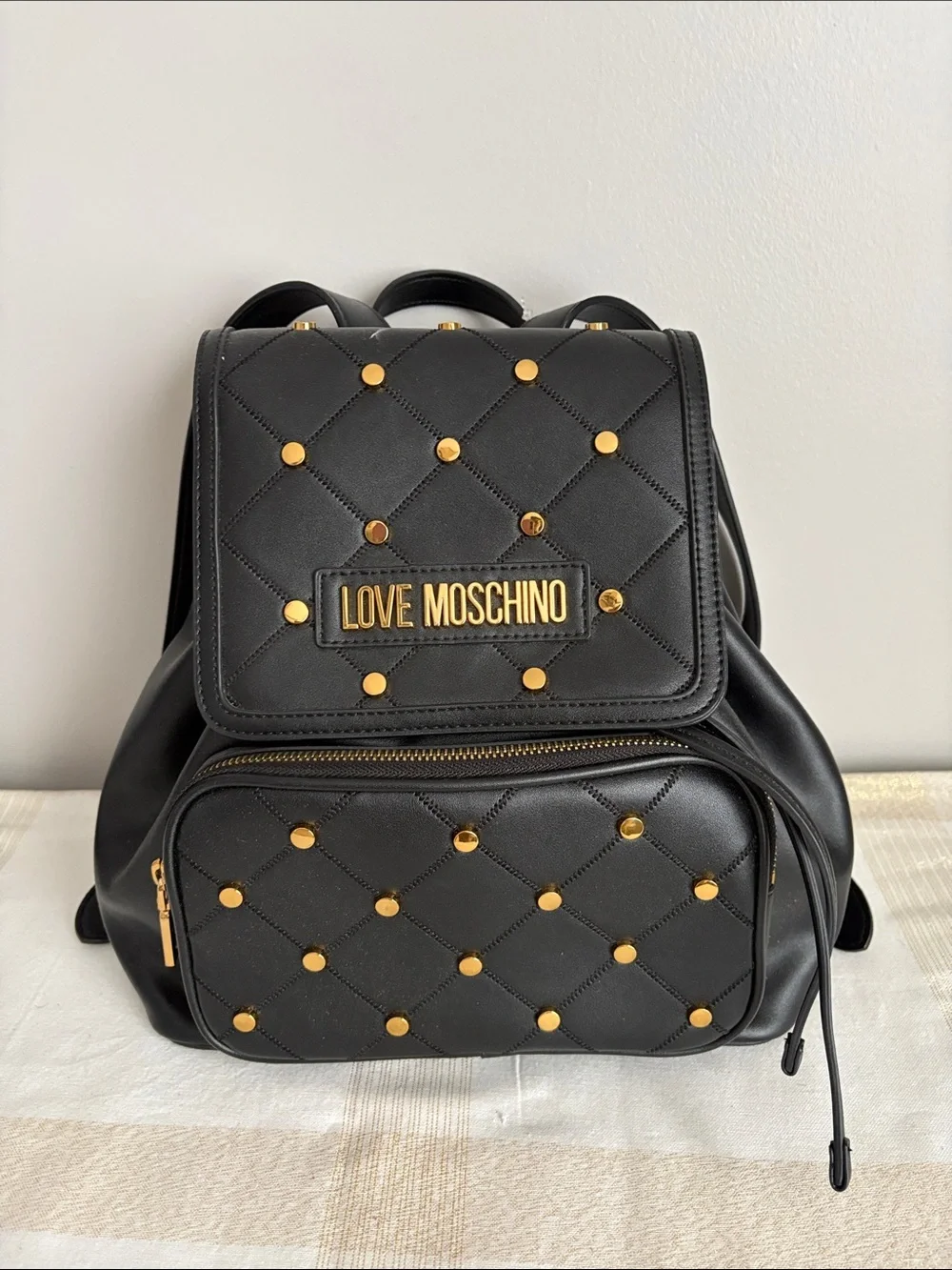BNWOT Designer LOVE MOSCHINO Backpack, Faux Leather, with gold metal design.